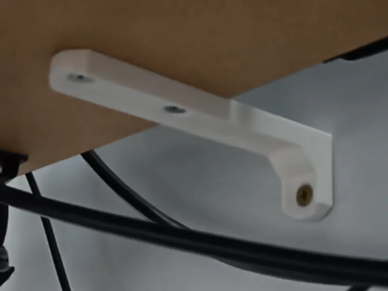 Table to wall securing bracket