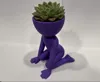 On hands and knees - yes, not a yoga pose, but cute!