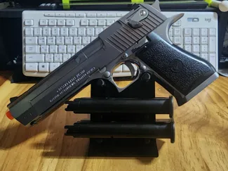simple handgun(pistol, gun) , two magazines stand