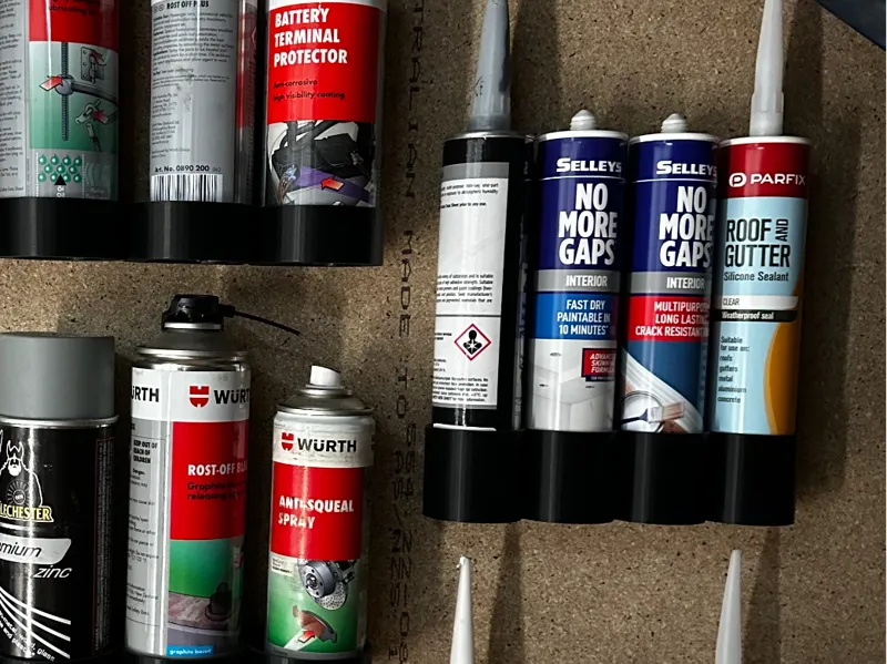 Caulking tube wall holder 
