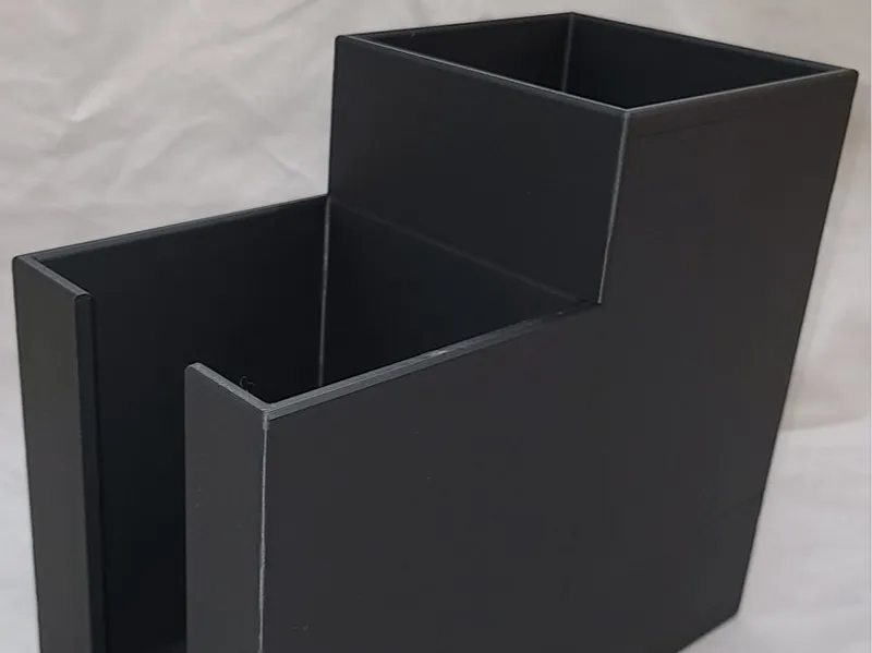 Straw and lid holder with elevated back