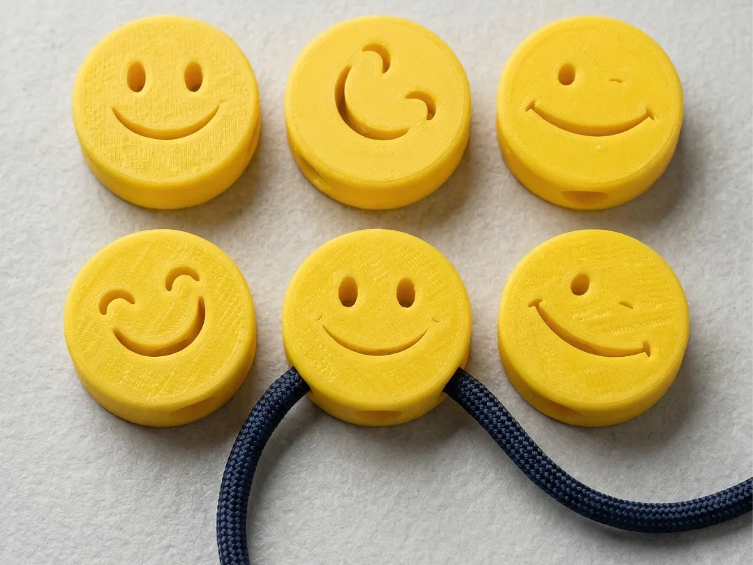 Perles smiley pour paracorde et lacets