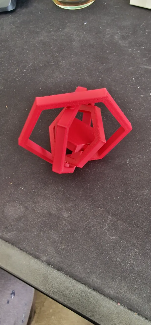 Dessous de verre spinner hexagonal