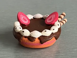 Cake with frosting and strawberry topping