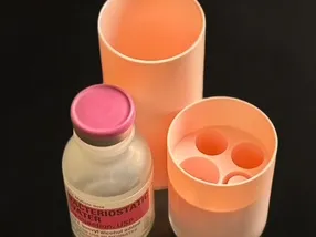 Bottle storage container with integrated insert