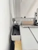 Narrower width and notch that slides under the printer