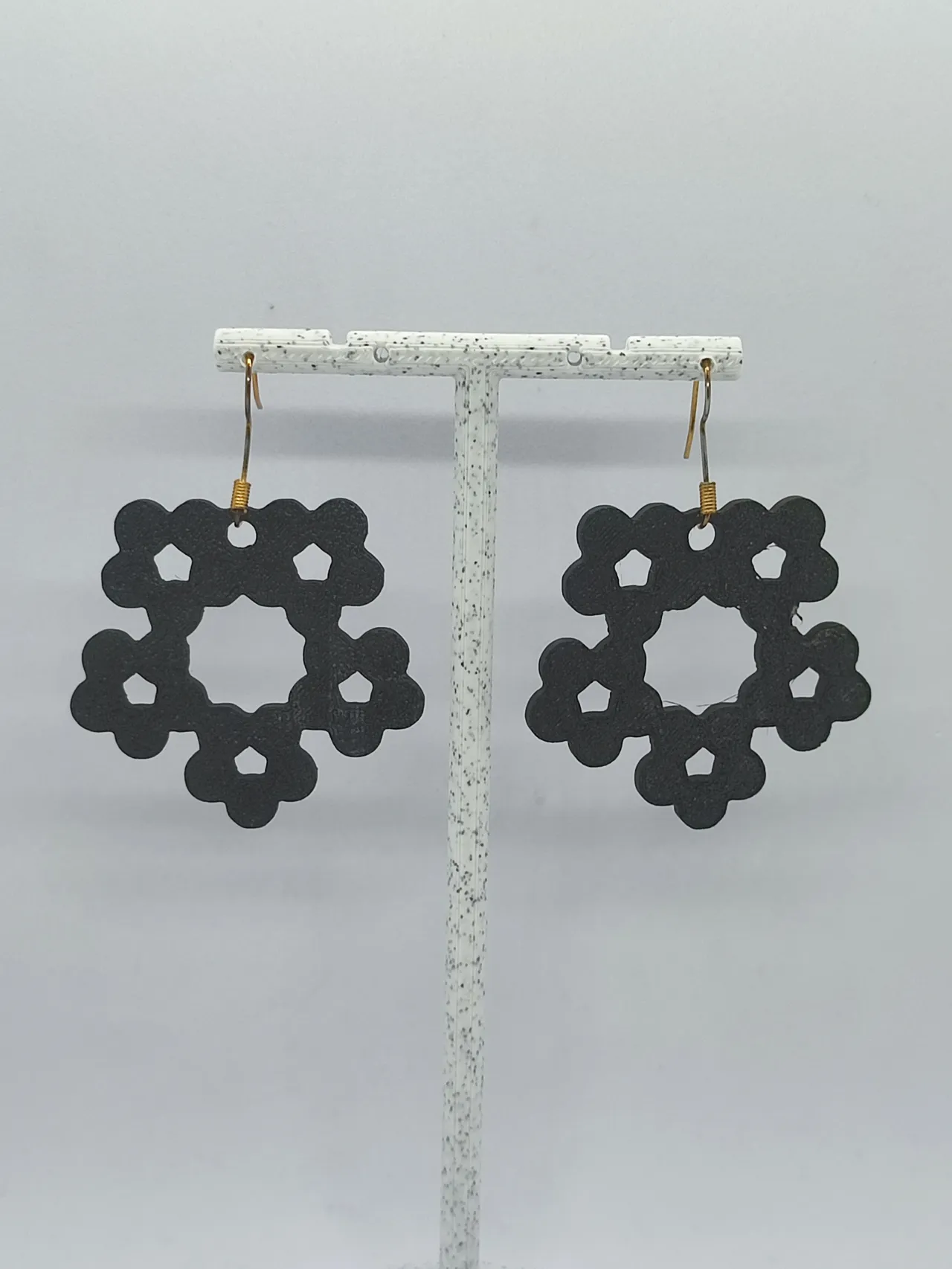 Aretes Flor Pentagonal view 3