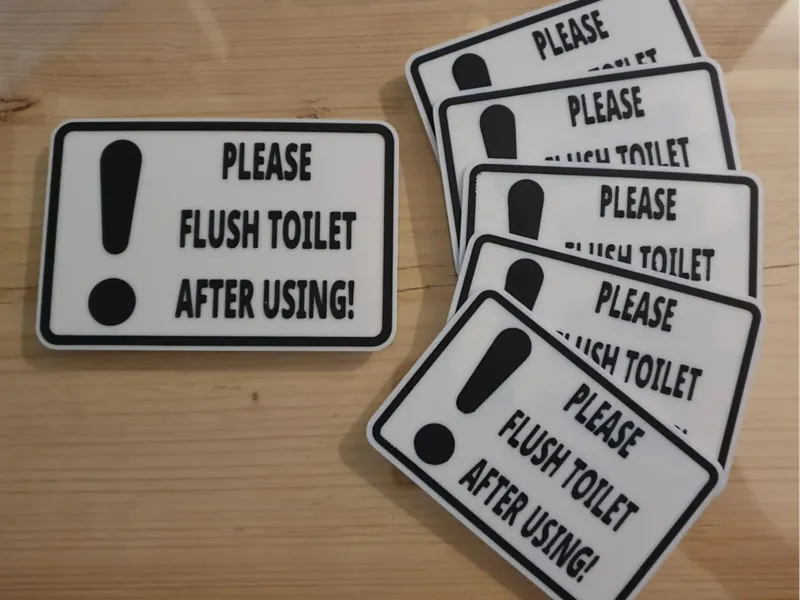 Please flush toilet after using sign.