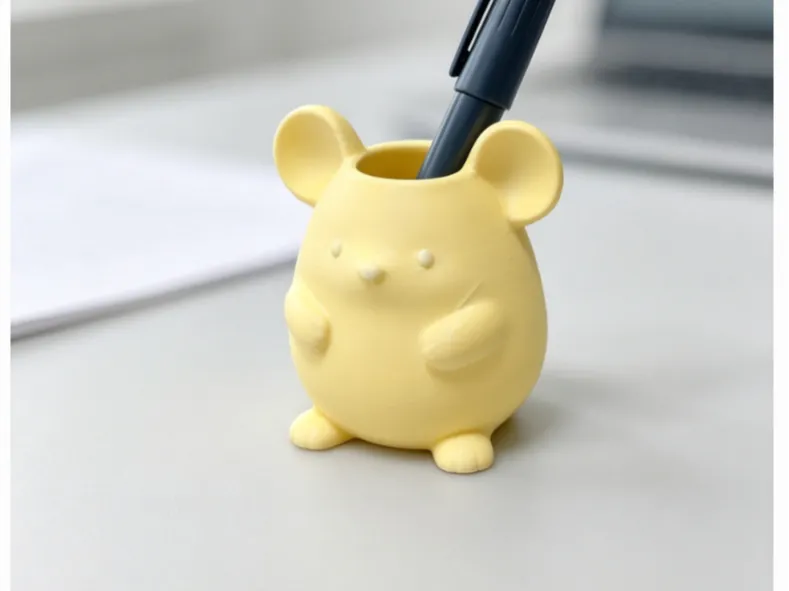 A pen holder in the shape of a little mouse