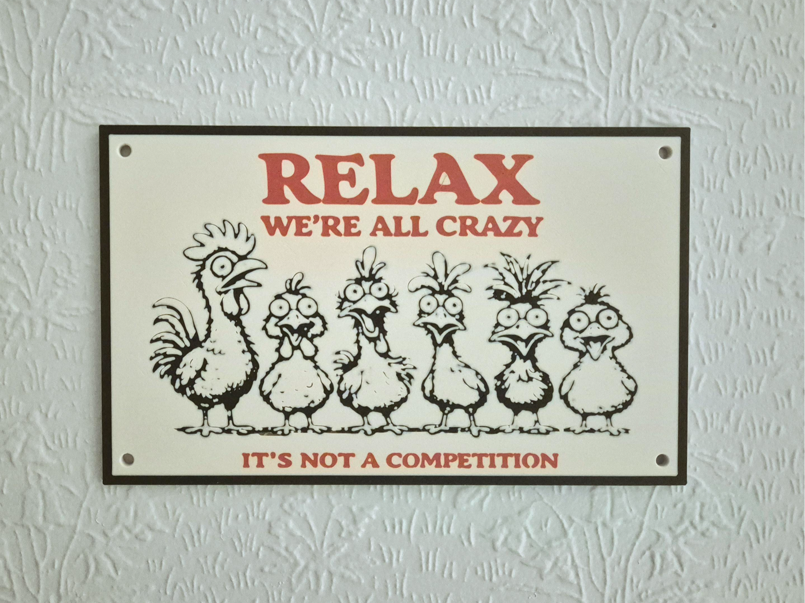 Funny Sign Relax – We’re All Crazy 