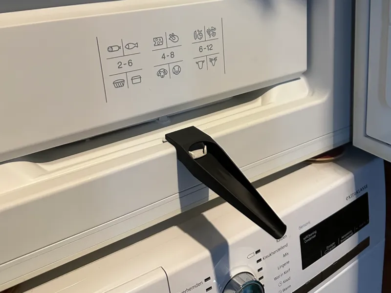 Defrost gutter extender for freezer