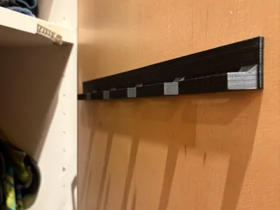 Inside closet belt hanger