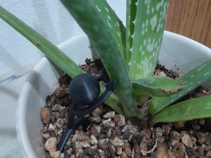 Stick guy holding up plant