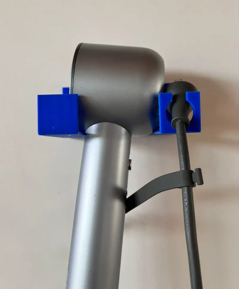 Universal shelf for hair dryer is perforation-free