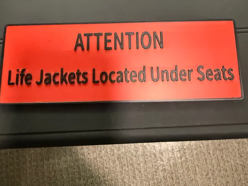 Life Jacket under seat sign