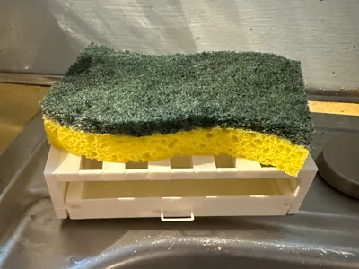 sponge holder with residue catcher