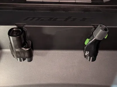Holder for plug adapter for Mach E frunk