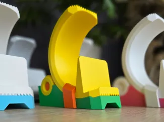 Adjustable phone stand based on a herringbone gear
