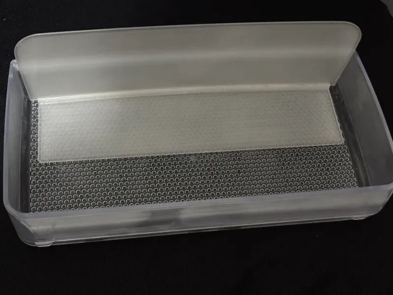 Fridge door basket barrier for low front baskets
