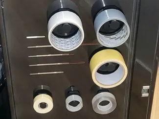 Wall-mounted tape holder