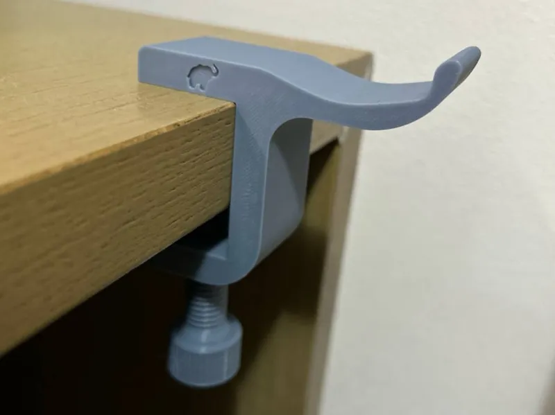 Adjustable headphones hanger 