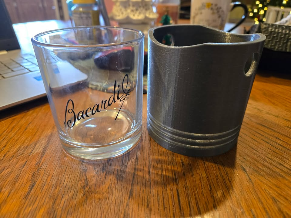 Low ball whiskey glass piston koozie