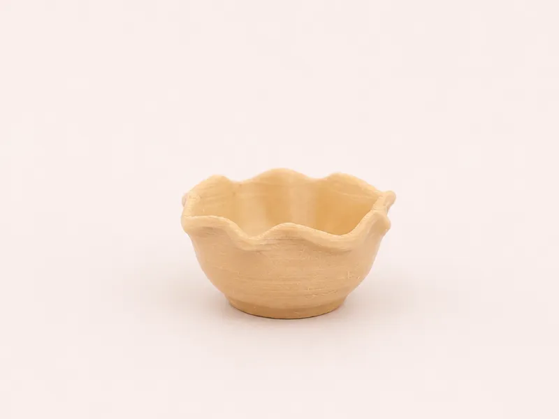 A bowl suitable for a dollhouse.