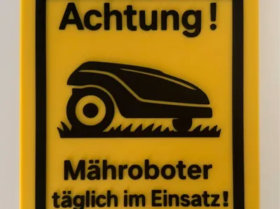 Warning Sign Robotic Mower in Daily Use
