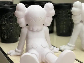 Kaws figure sitting