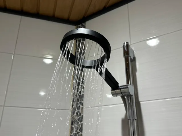 Modern, minimalistic rainfall shower head