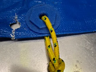Eyelets for repairing tarpaulins
