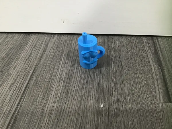 Mini figurine souriante à poignée