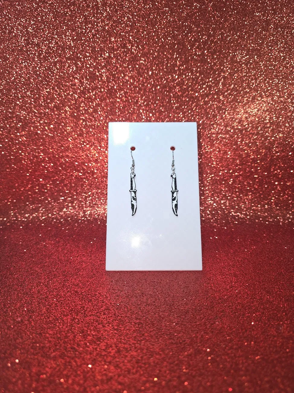 Scream knife earrings view 2