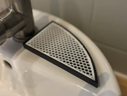 Corner soap dish with honeycomb design