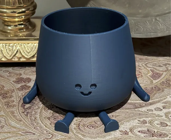 Cache-pot visage souriant