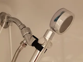 Shower head lowerer