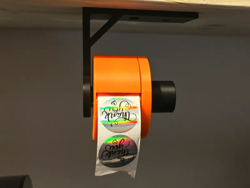 Holder for a tape roll