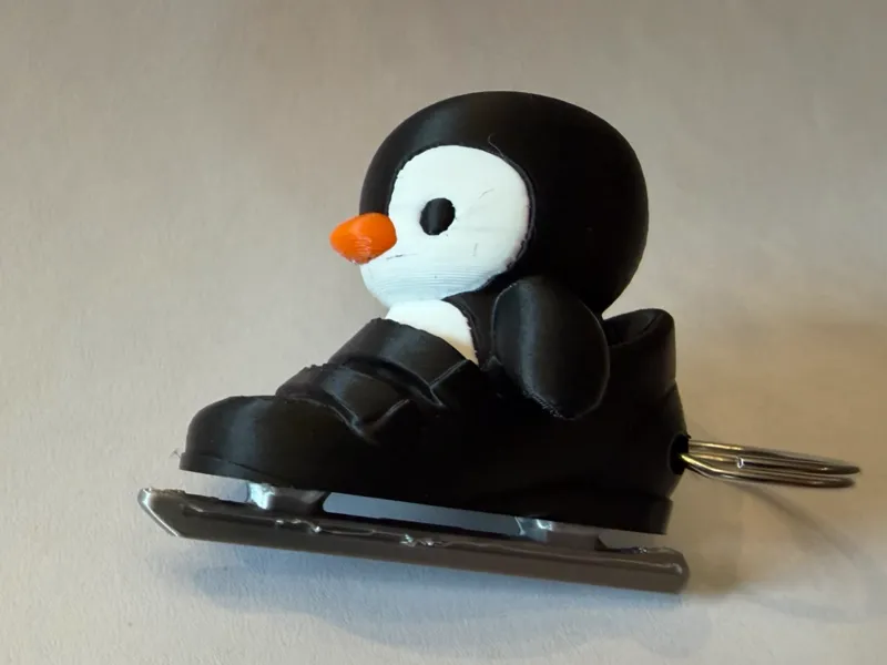 Iceskating penguin keychain