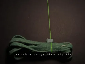 Reusable zip tie made with a purge line