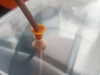 The smooth interface after drilling the rice bin prevents jamming at multiple angles.  The filament passes through smoothly without jamming the lid. Two versions are provided: one for tubes and one without.