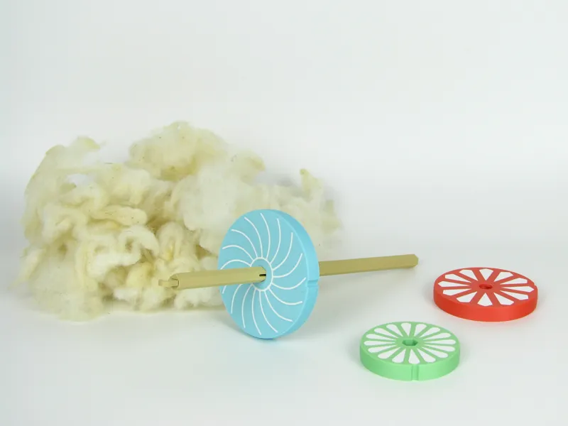 Drop spindle with interchangeable whorls