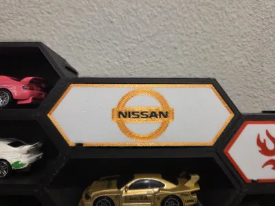Nissan logo insert for the famous 1:64 box
