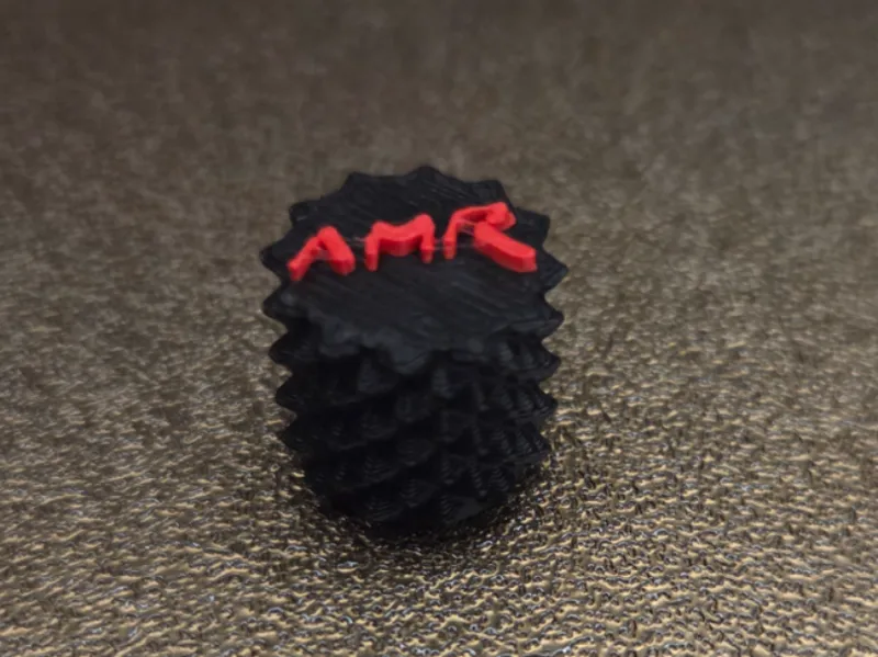 Tire valve cap Aston Martin Racing logo