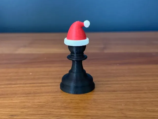 Christmas chess pawn with Santa hat