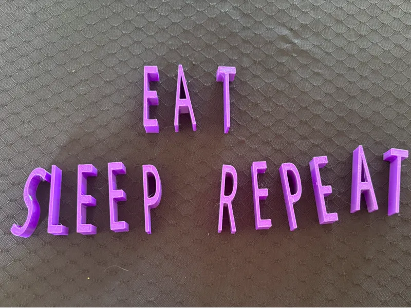 EAT SLEEP REPEAT sign