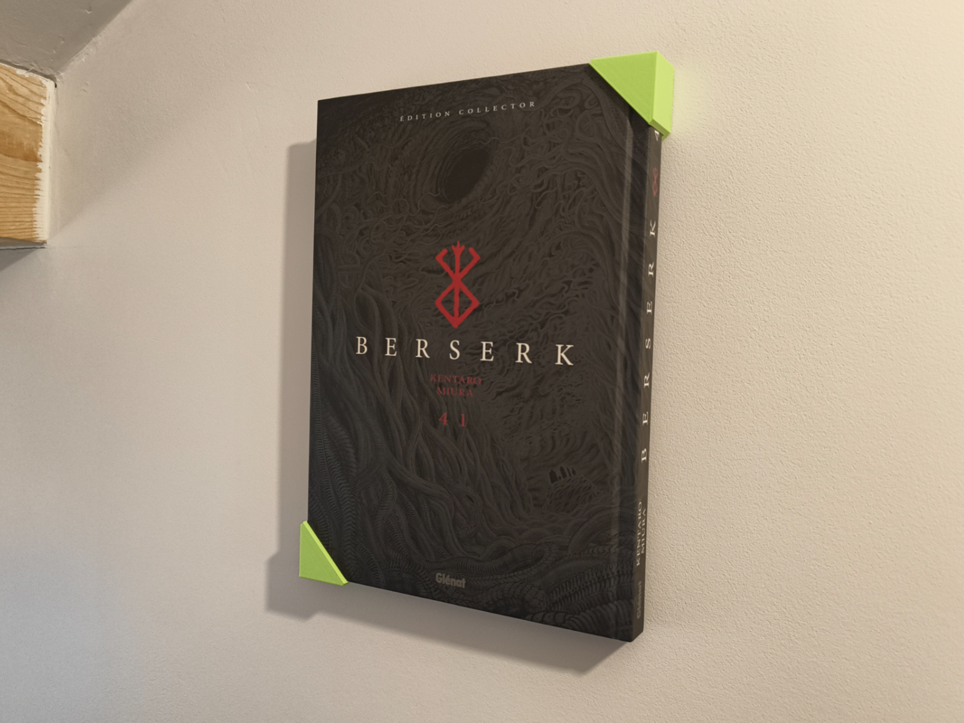 Simple wall-mounted book holder