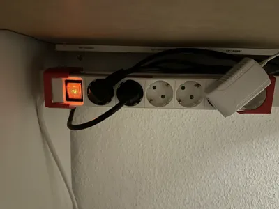 Holder for power strip under Ikea Micke