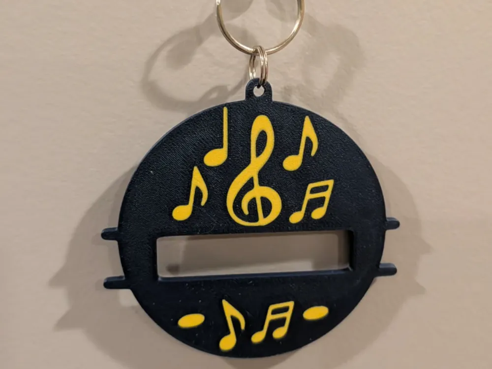 Accesorio para sujetar ligas de cabello: Music hair tie keychain. Referencia del modelo original.