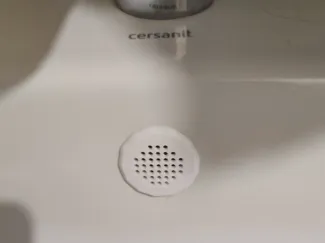 Almost round sink overflow cover (plug)