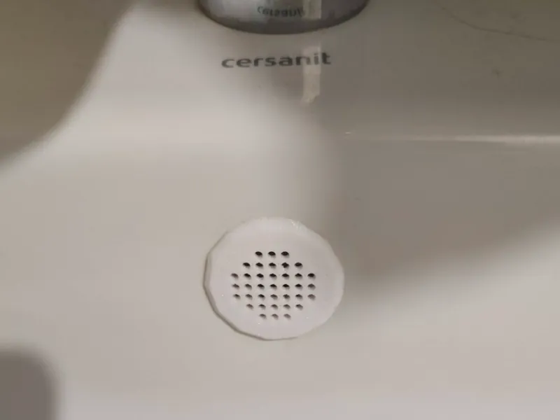 Almost round sink overflow cover (plug)